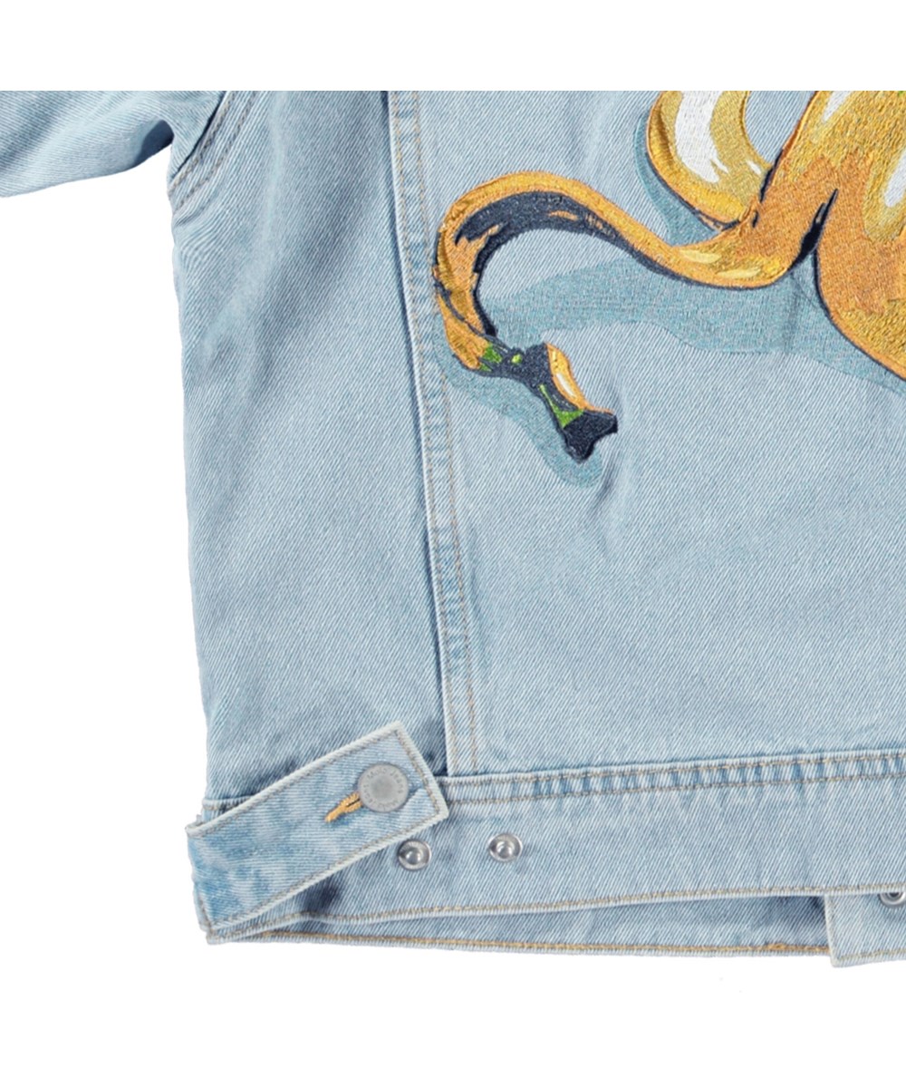 Honore - Sun-Bleach Blue - Light blue denim jacket for children in cotton with a banana peel embroidery on the back and the text on the sleeve "If you slip.... Get back up".