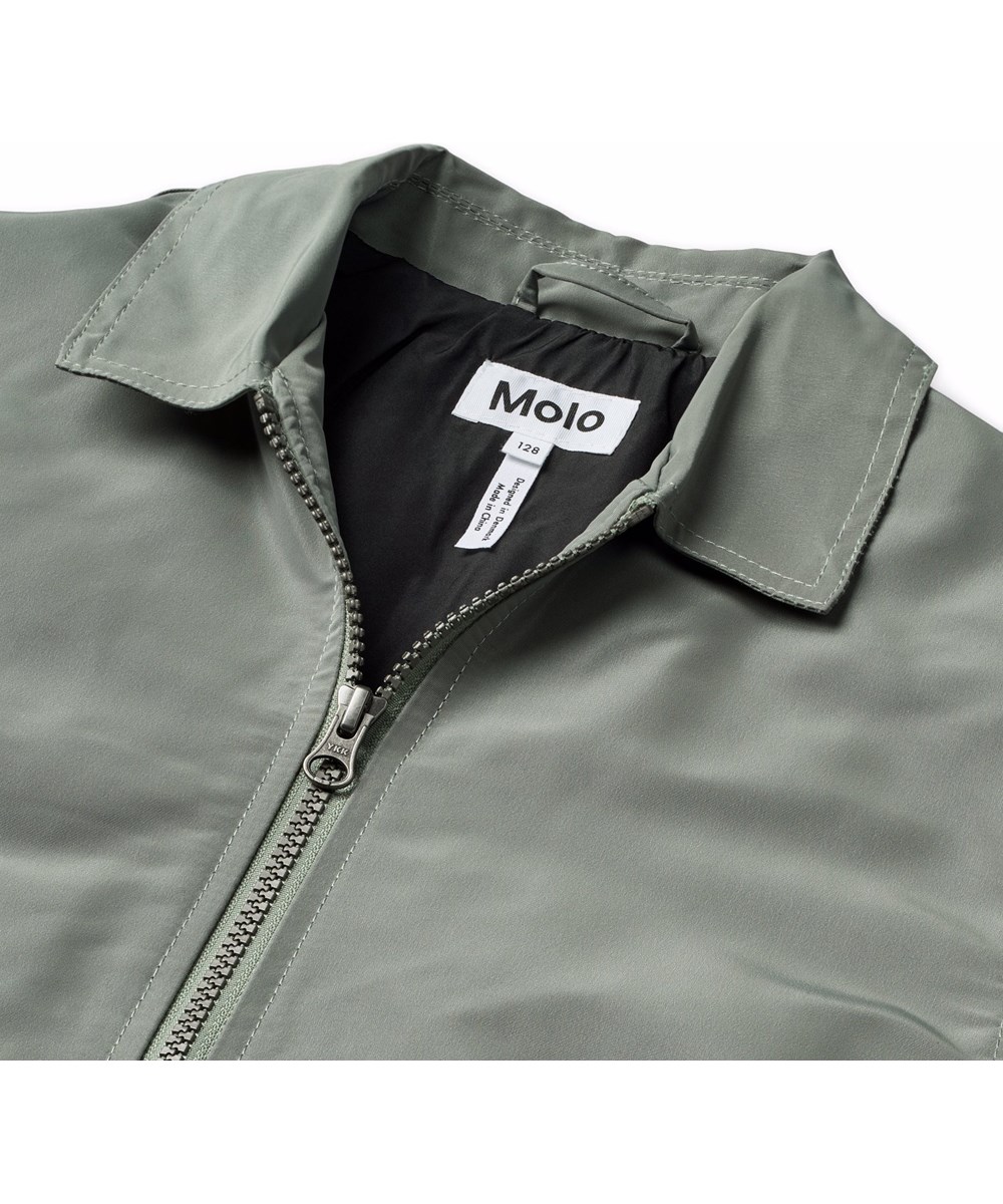 Hotson - Heated - Grey jacket for children with black flames made of shiny polyester.