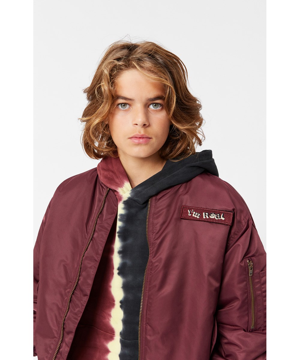 Howie - Dragon Blood -  Burgundy bomber jacket with a zipper.