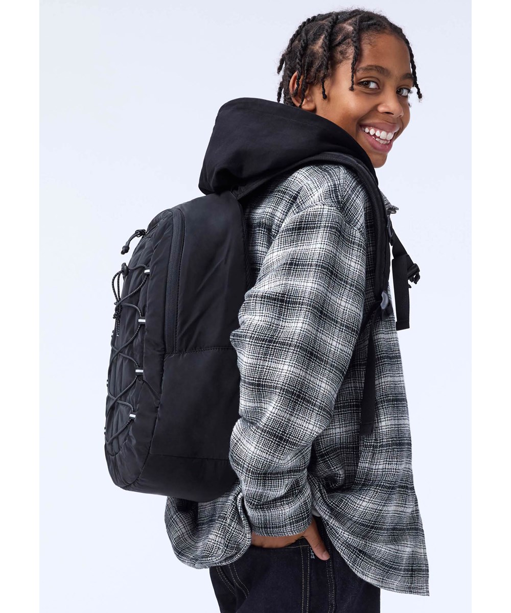 Hugin - Moon Check - Checkered black and white overshirt for children made of soft organic cotton with soft teddy lining.