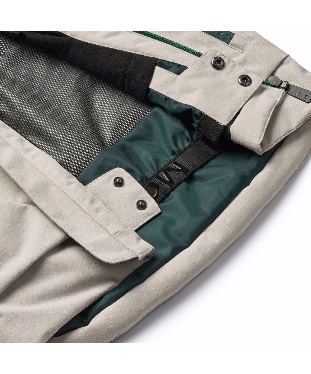 Alpine - Block - Petroleum green and sand-coloured wind- and waterproof ski jacket for children in recycled nylon and polyester.