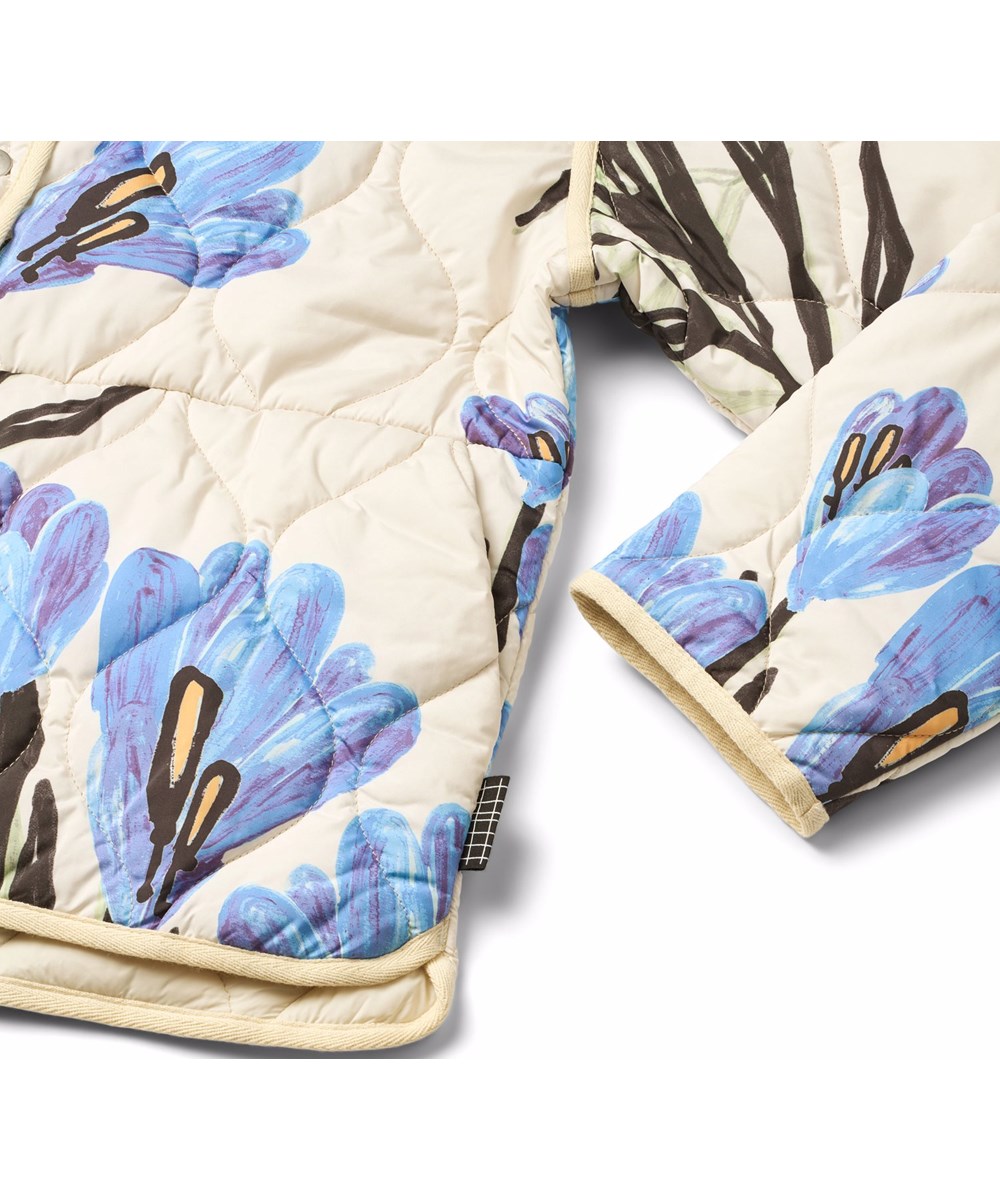 Hailey - Painted Crocus - Off-white wind and water-resistant padded jacket for children made of soft cotton with a wavy quilted pattern and floral print.