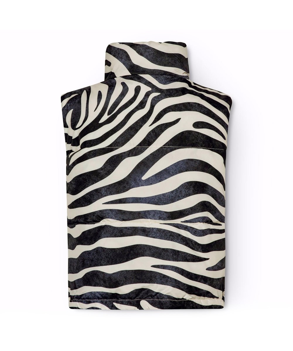 Halfrida - Zebra - Quilted vest. for children with zebra-striped pattern made from recycled polyester.