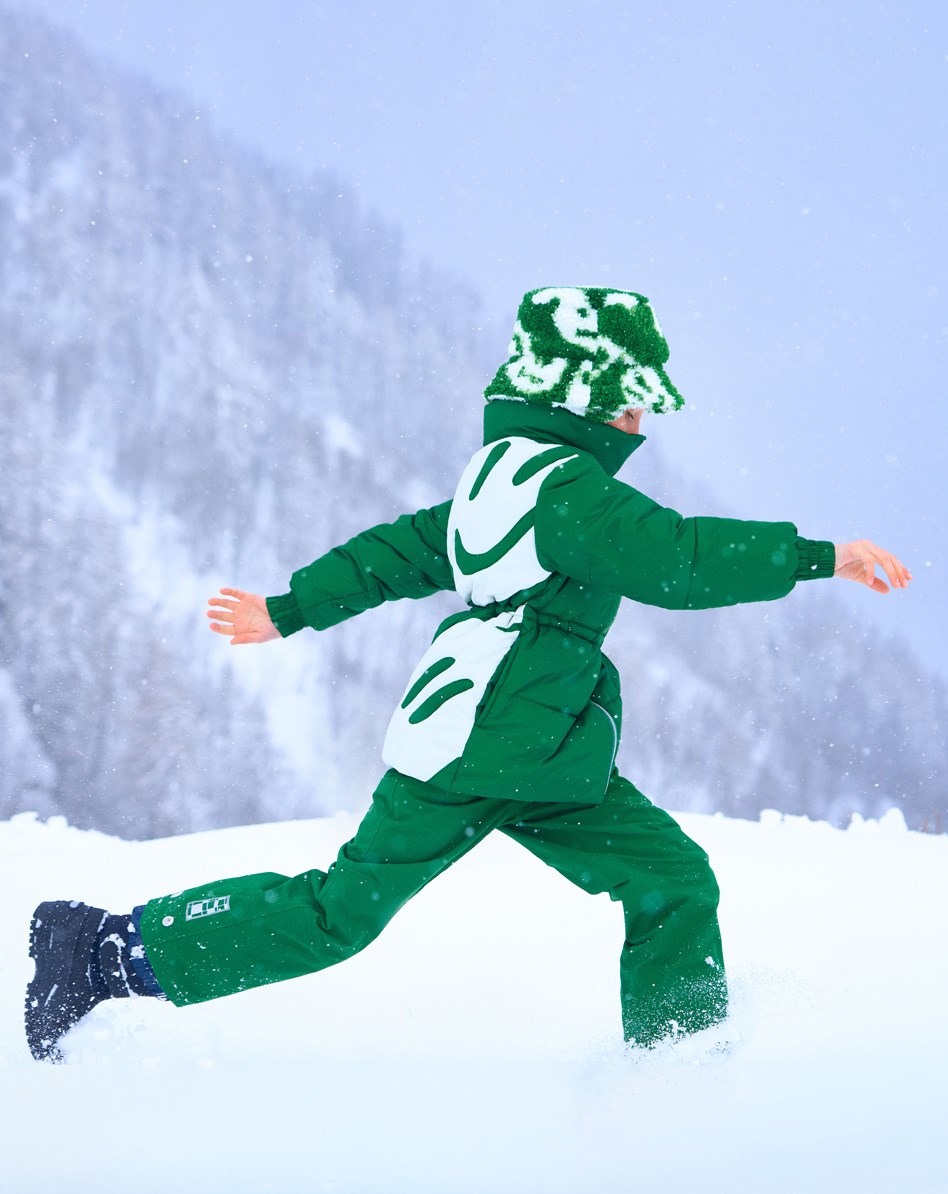 Hally - Woodland Smiles - Green puffer jacket with white smiley print on the back