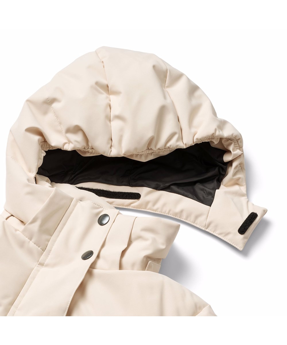 Hansine Pro - Vanilla - Wind and water-repellent off-white winter jacket for children in recycled polyester with recycled polyester filling and 3M™ Thinsulate™.