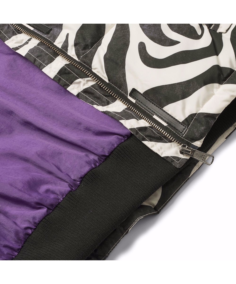 Hansine - Zebra - Water-repellent jacket for children in recycled polyester with zebra print.