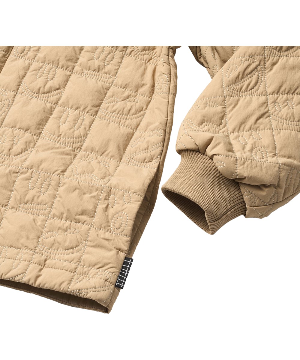 Harold - Desert - Sand-coloured wind and water-repellent quilted cotton jacket  for children with soft ribbing at the neck and sleeves.