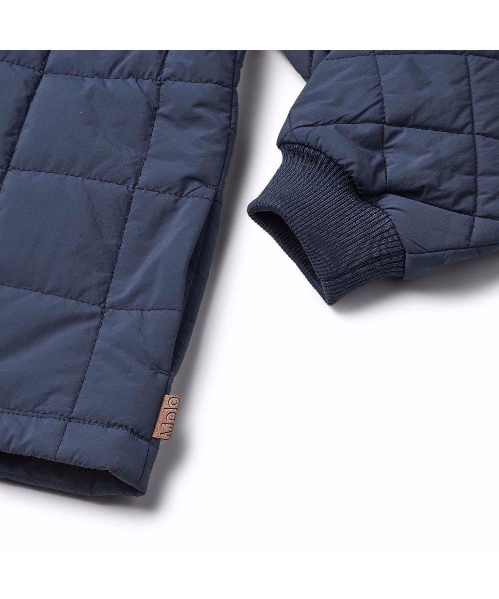 Harold - Mood Blue - Dark blue, quilted, water-resistant thermal jacket for children in recycled nylon with canvas details and a zip chest pocket.