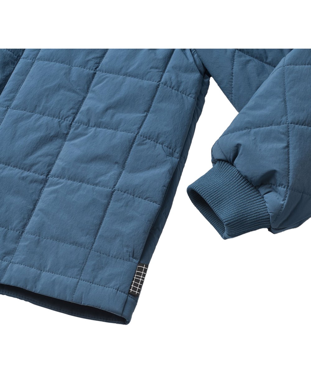 Harold - Oceanica - Blue wind and water-repellent quilted cotton jacket  for children with soft ribbing at the neck and sleeves.