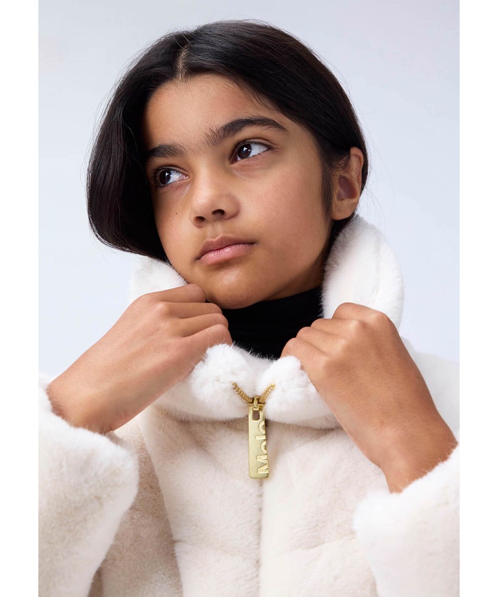 Havi 2 - Vanilla - Off-white jacket for children in soft. imitation fur made of recycled polyester.