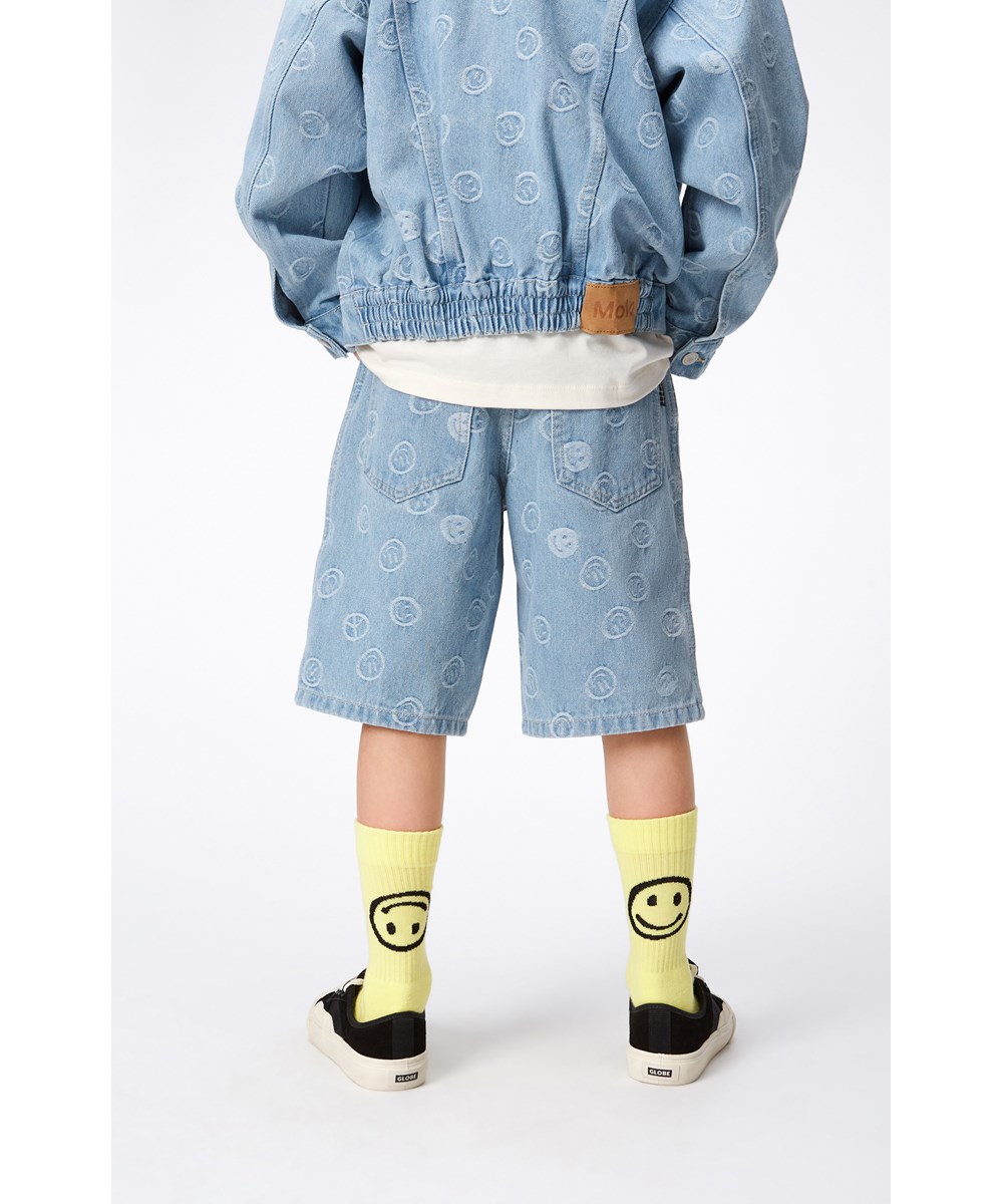 Hedly - Happiness Light - Light blue denim, children's jacket with smiling face and peace sign print