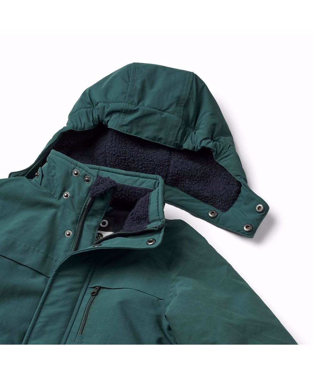 Heiko - Ponderosa Pine - Dark green wind- and waterproof winter jacket for children in recycled nylon.