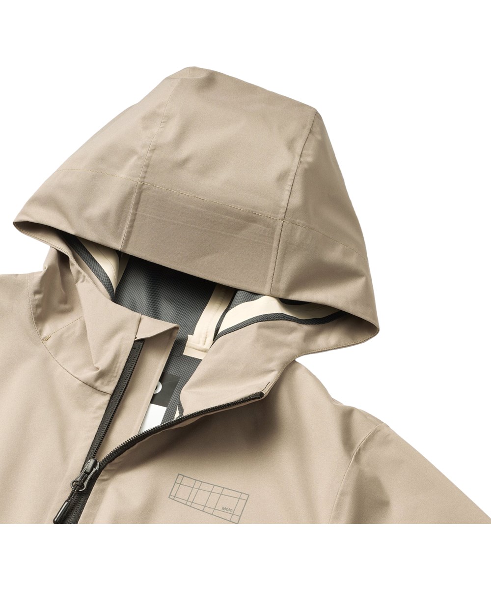 Horizon - Clay - Sand-coloured wind- and waterproof jacket for children with hood and laminated interior made from recycled polyester.