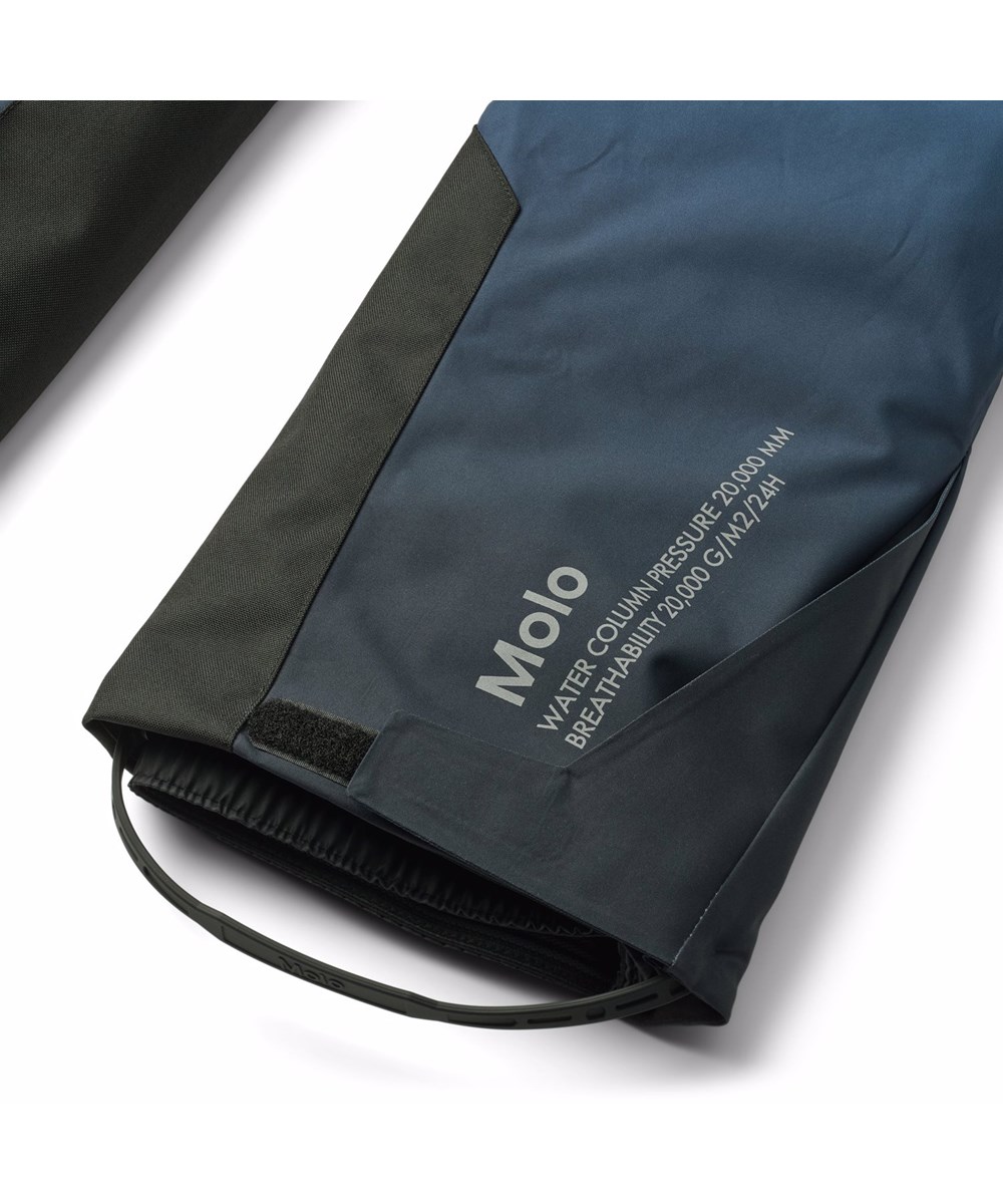 Jump Pro - Blue Ice - Wind and waterproof ski pants for children in blue gradient colors made of recycled polyester and padded with 3M™ Thinsulate™.