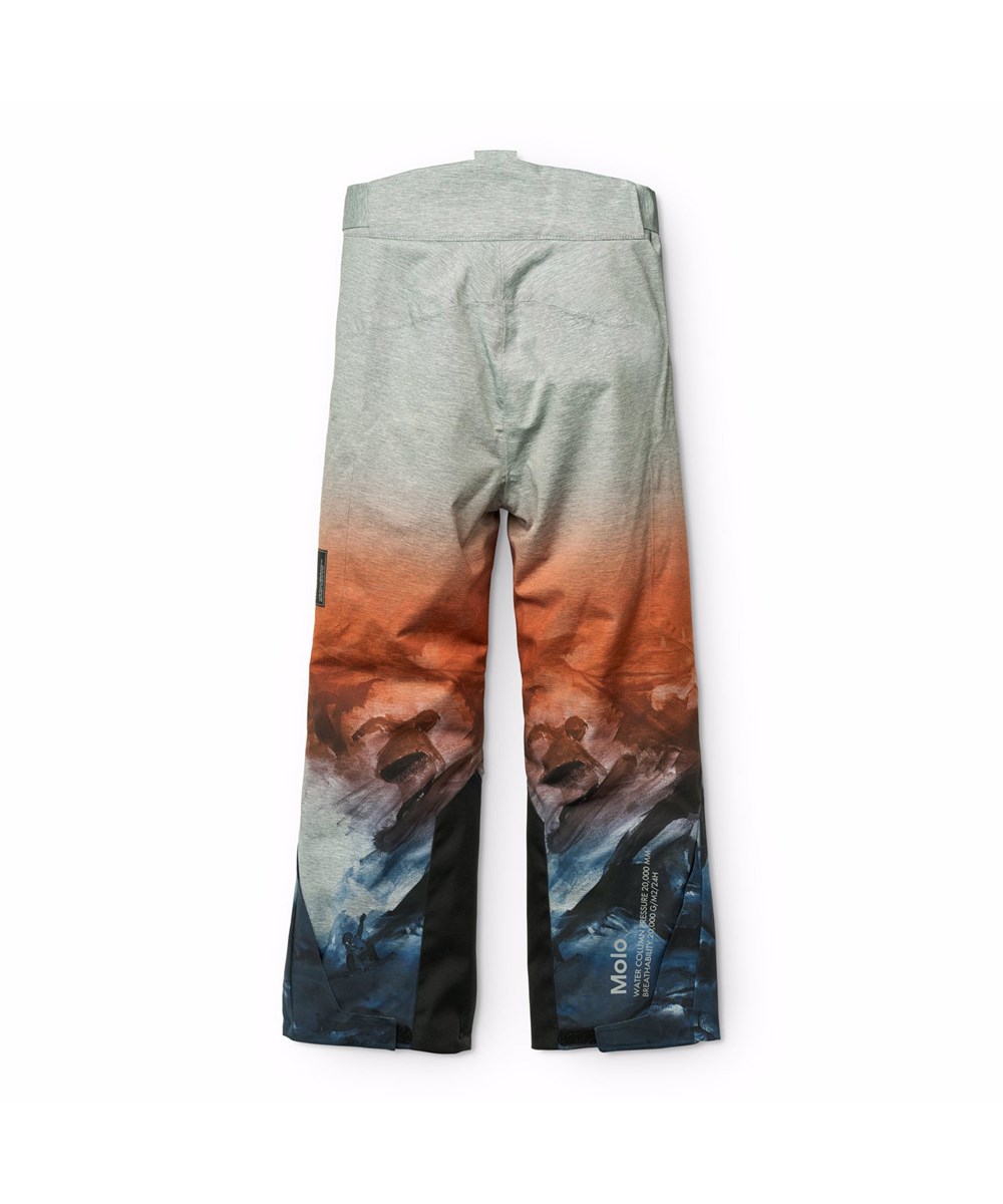 Jump Pro - Sunrise - Wind and waterproof ski pants for children in grey, orange, and blue with a print of snowboarders in the Alps. It is made of recycled polyester and padded with 3M™ Thinsulate™.
