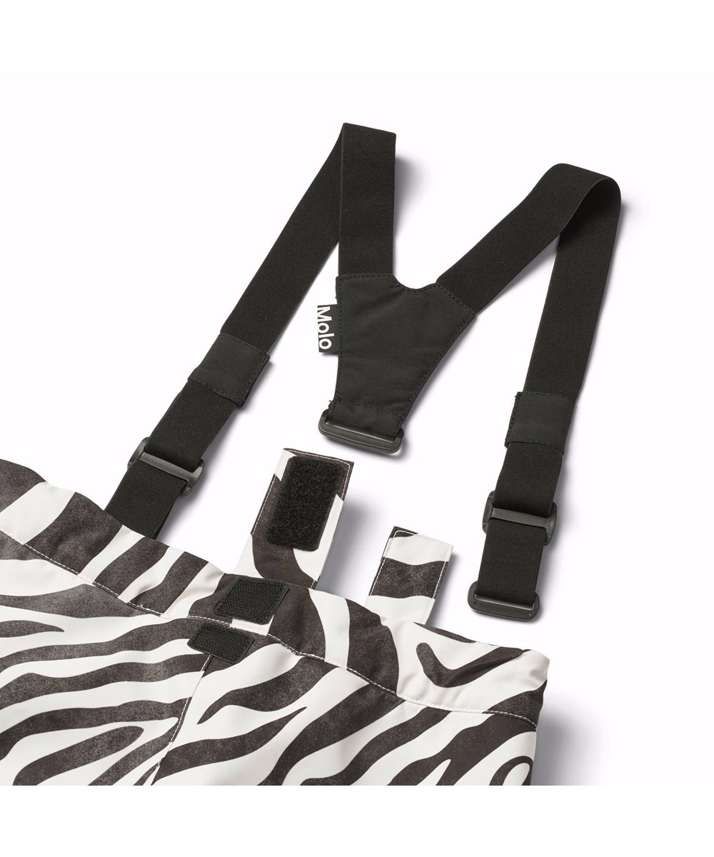 Jump Pro - Zebra - Wind- and waterproof children's trousers in recycled polyester with black and white zebra stripes.
