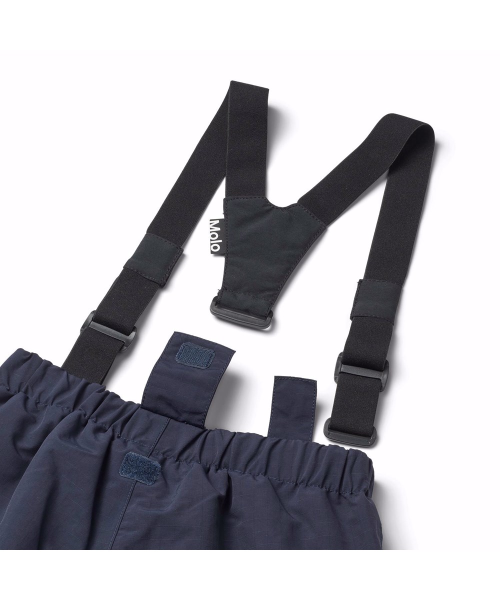 Paxton - Dark Night - Wind- and waterproof snow pants for children in dark blue made from recycled nylon.
