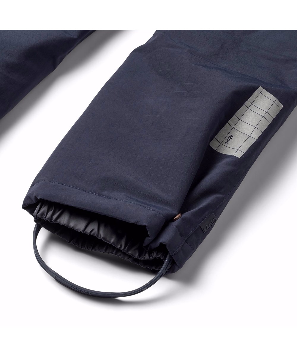 Paxton - Dark Night - Wind- and waterproof snow pants for children in dark blue made from recycled nylon.