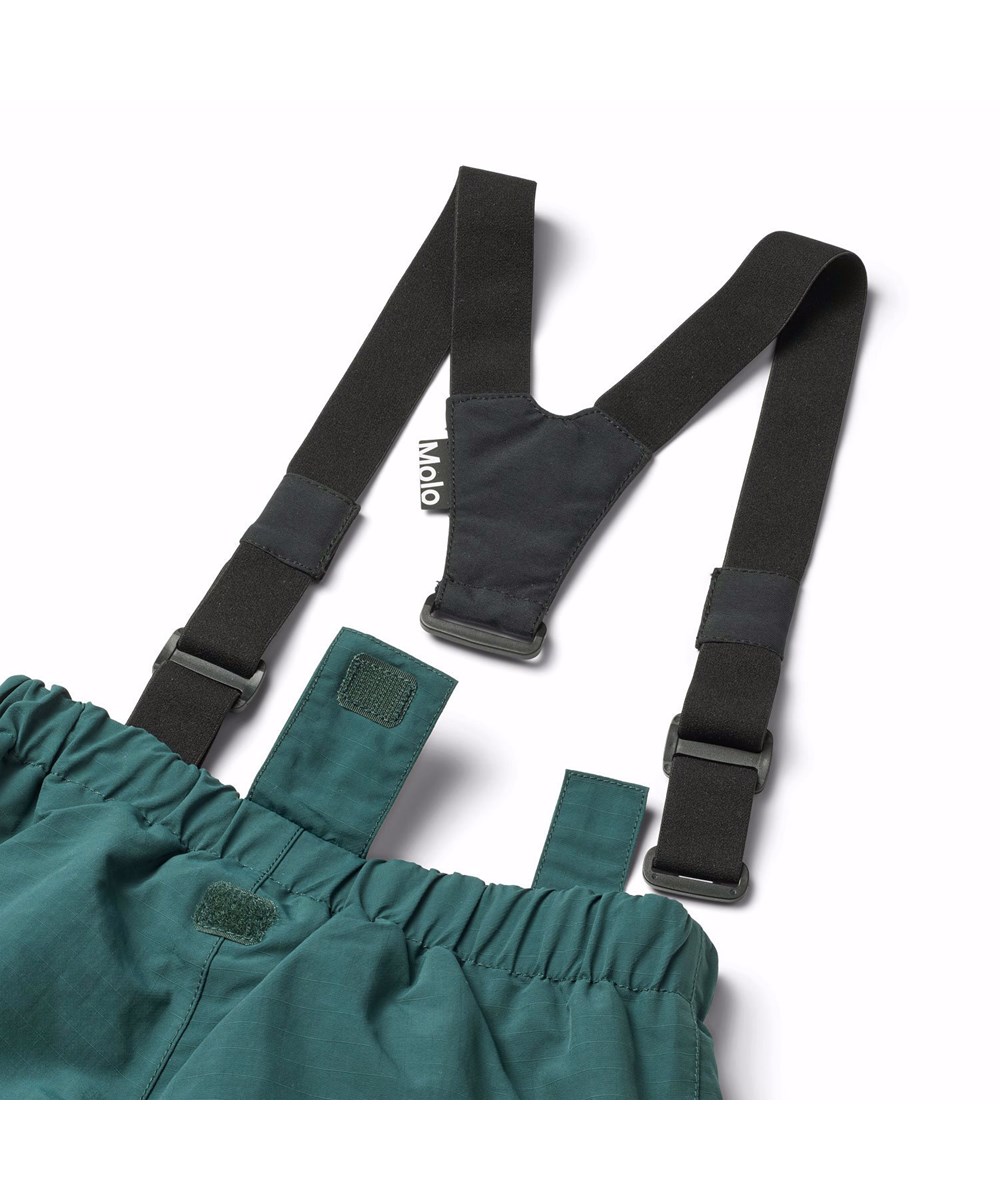 Paxton - Ponderosa Pine - Wind- and waterproof snow pants for children in dark green made from nylon.