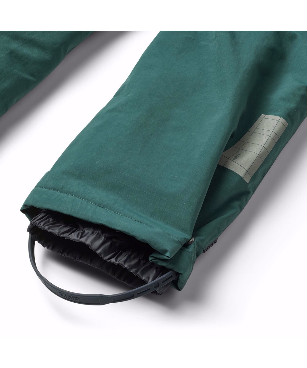 Paxton - Ponderosa Pine - Wind- and waterproof snow pants for children in dark green made from nylon.