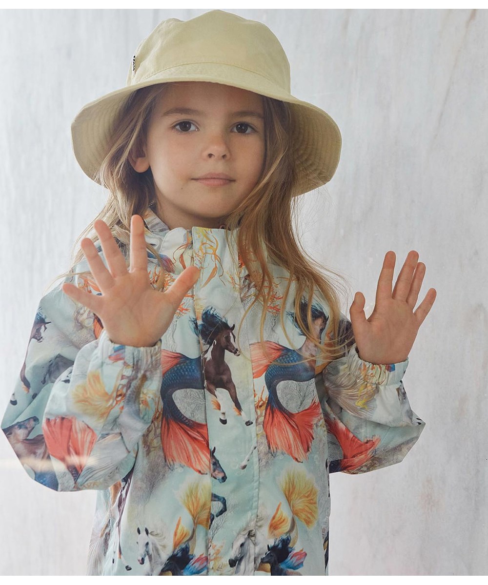 Waiton - Swiming Horses - Rain jacket in light blue with sea horse print 