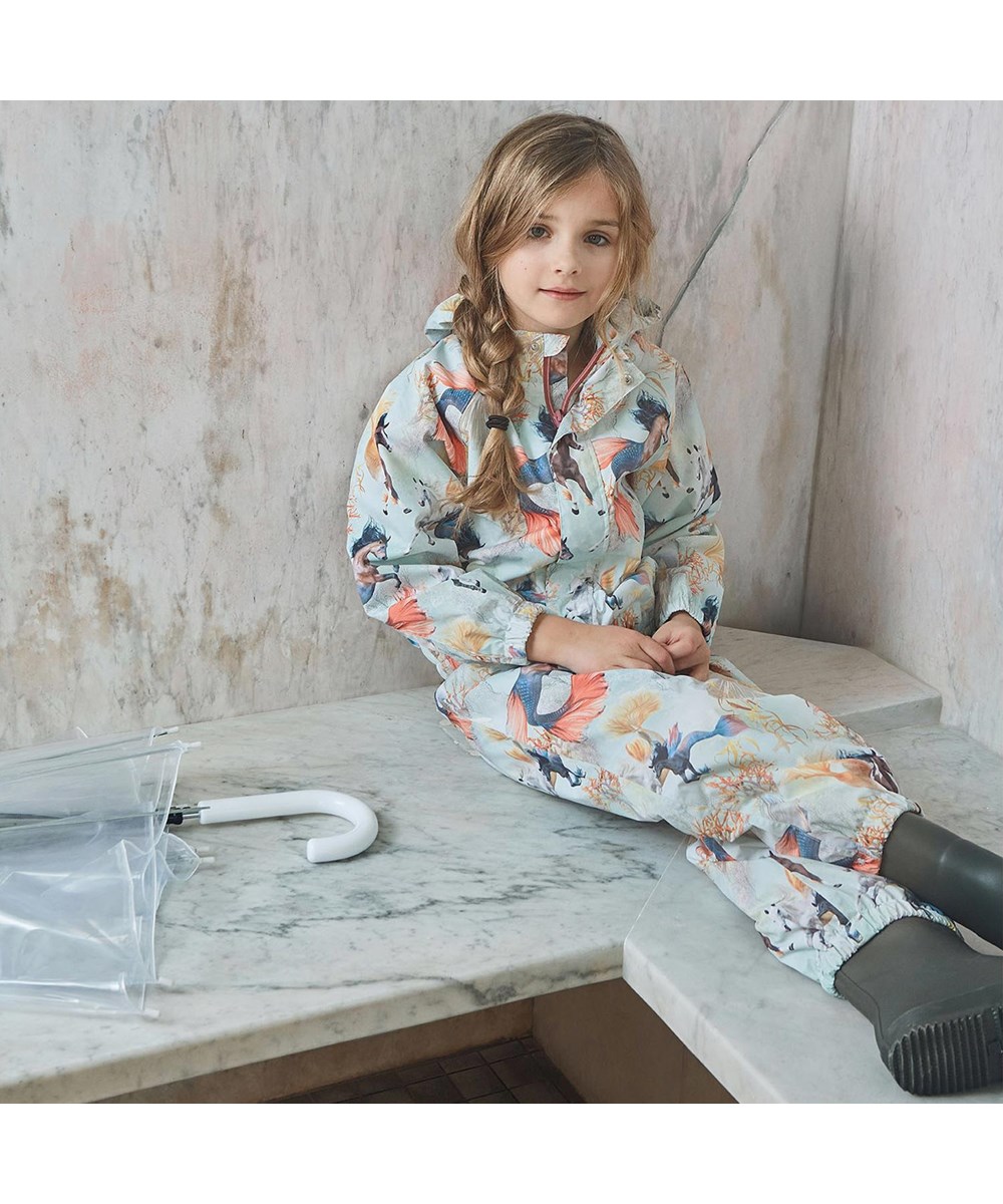 Waiton - Swiming Horses - Rain jacket in light blue with sea horse print 