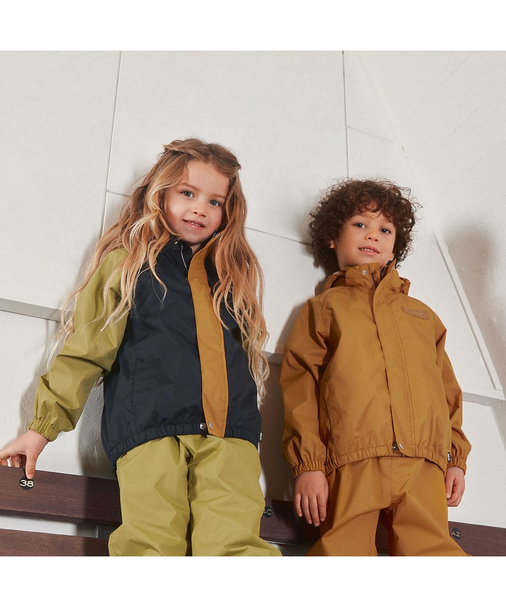 Waits - Almond - Lightweight and breathable rain trousers in golden yellow