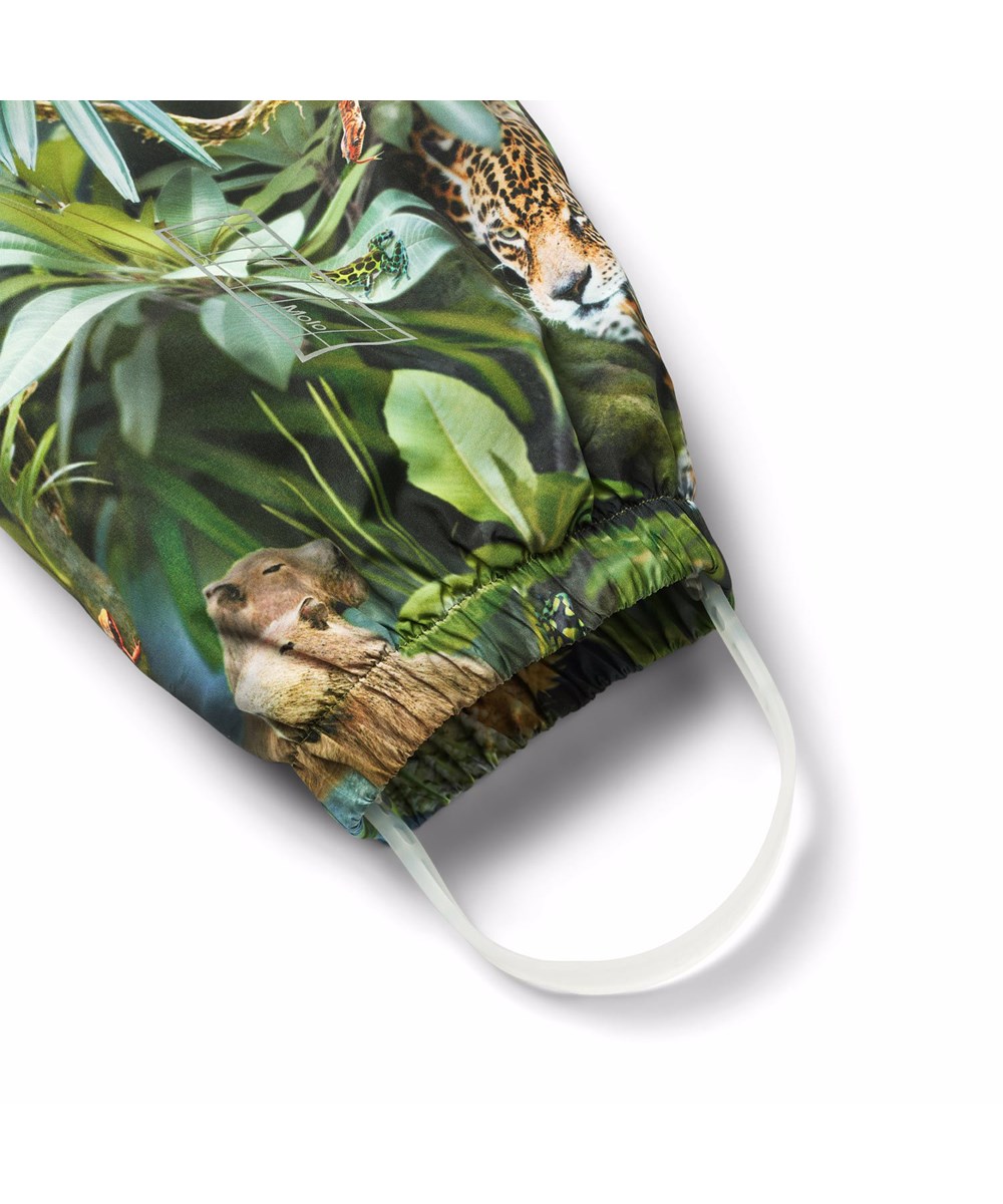 Waits - Jungle Life - Green wind and waterproof rain trousers for children in durable and recycled polyester.