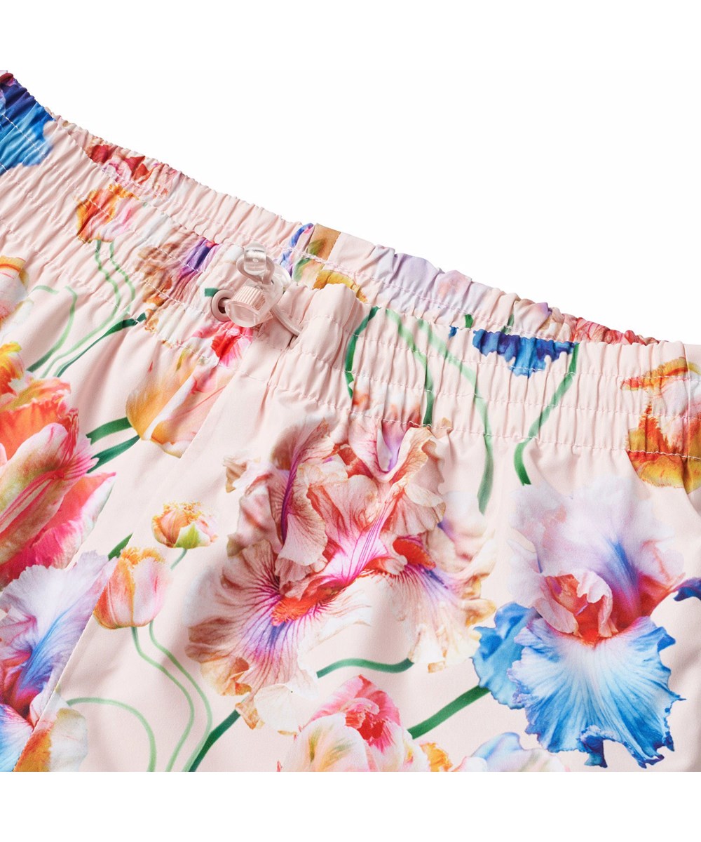 Waits - Tulip Pink - Light blue wind and waterproof rain trousers for children in durable and recycled polyester.