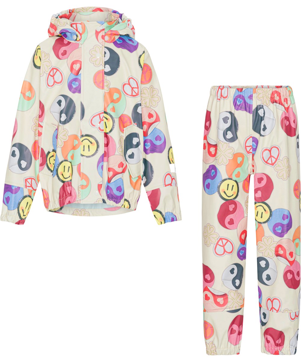 Zet - Yin Yang - Rubber rainwear set with a print of smiling faces, hearts, peace signs and yin/yang symbols