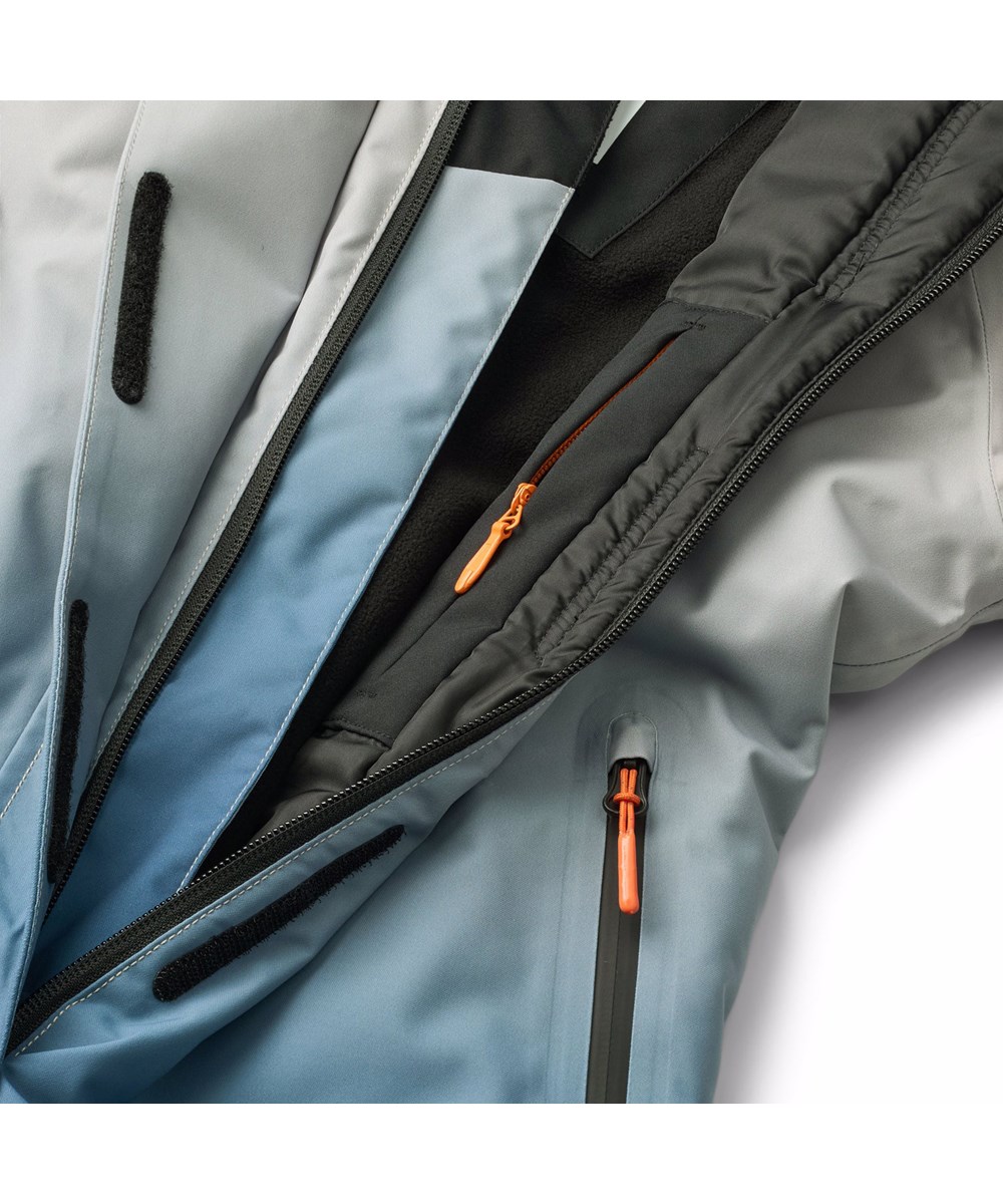 Hux - Blue Ice - Wind and waterproof snowsuit in blue gradient colours for a cold winter or ski holiday in recycled polyester and padded with 3M™ Thinsulate™.