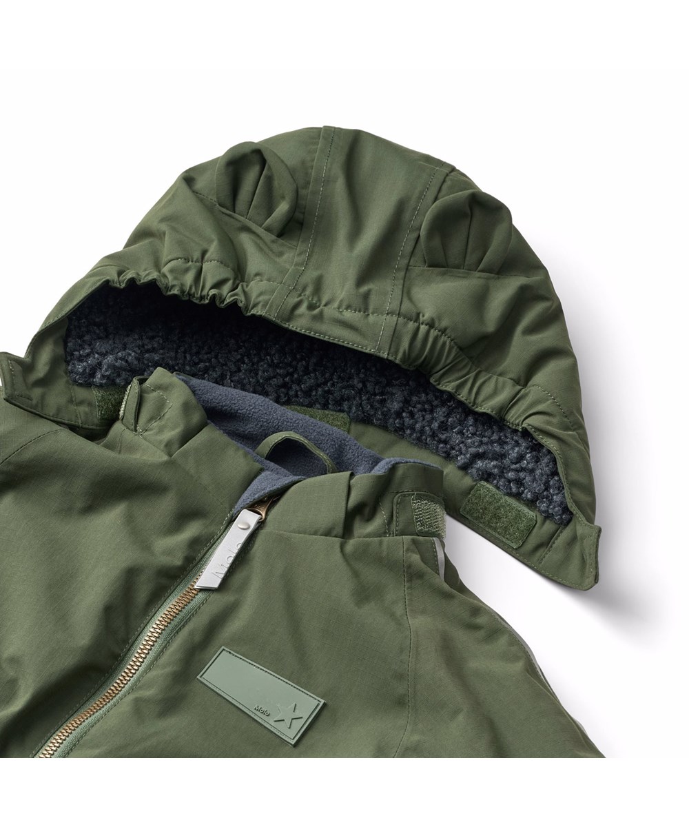 Hyde - Dark Forest - Water-repellent dark green snowsuit for the little ones made of recycled nylon.