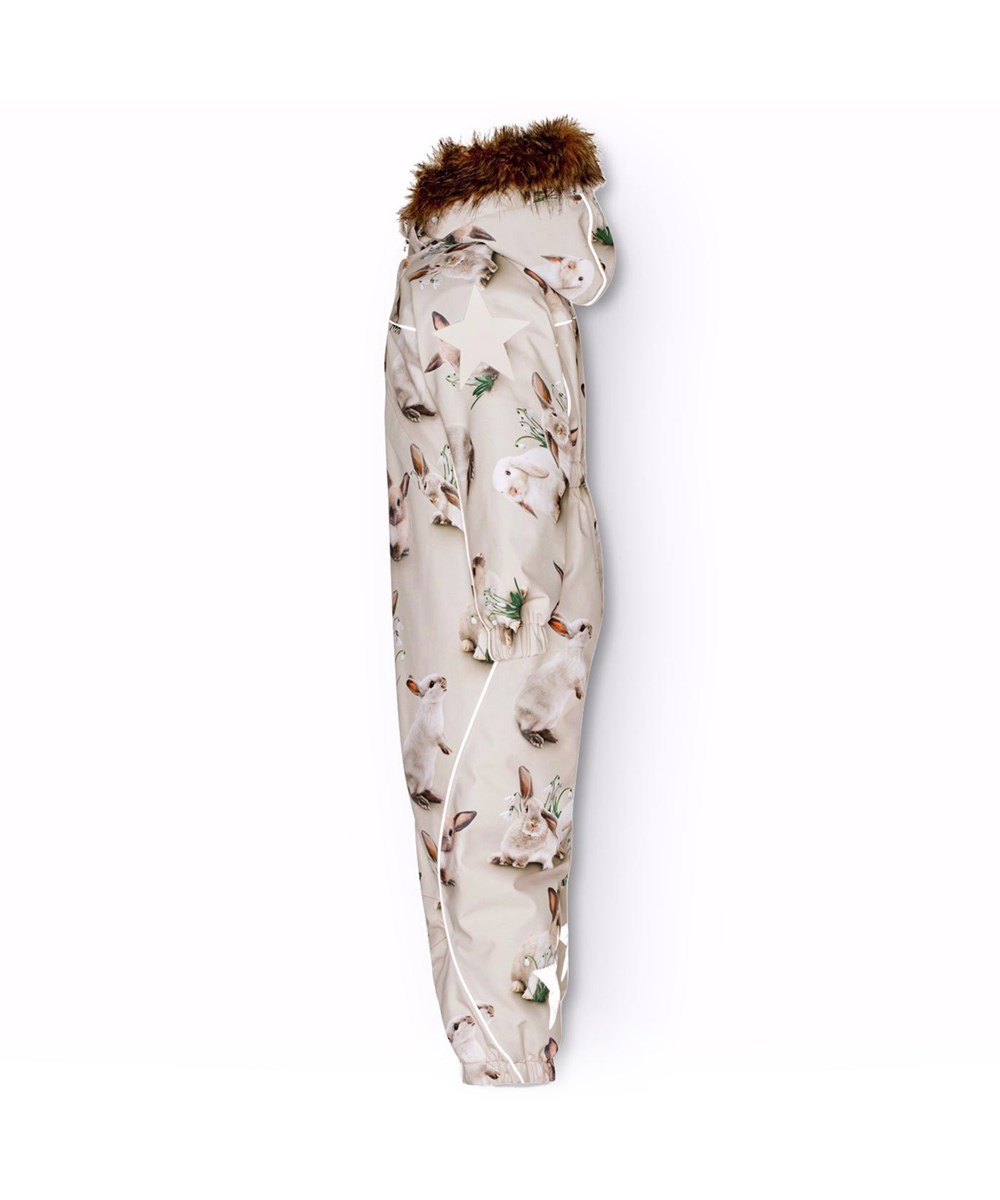 Polaris Fur - Winter Rabbits - Children's snowsuit in recycled polyester with a print of adorable rabbits among snowdrops on a grey background.