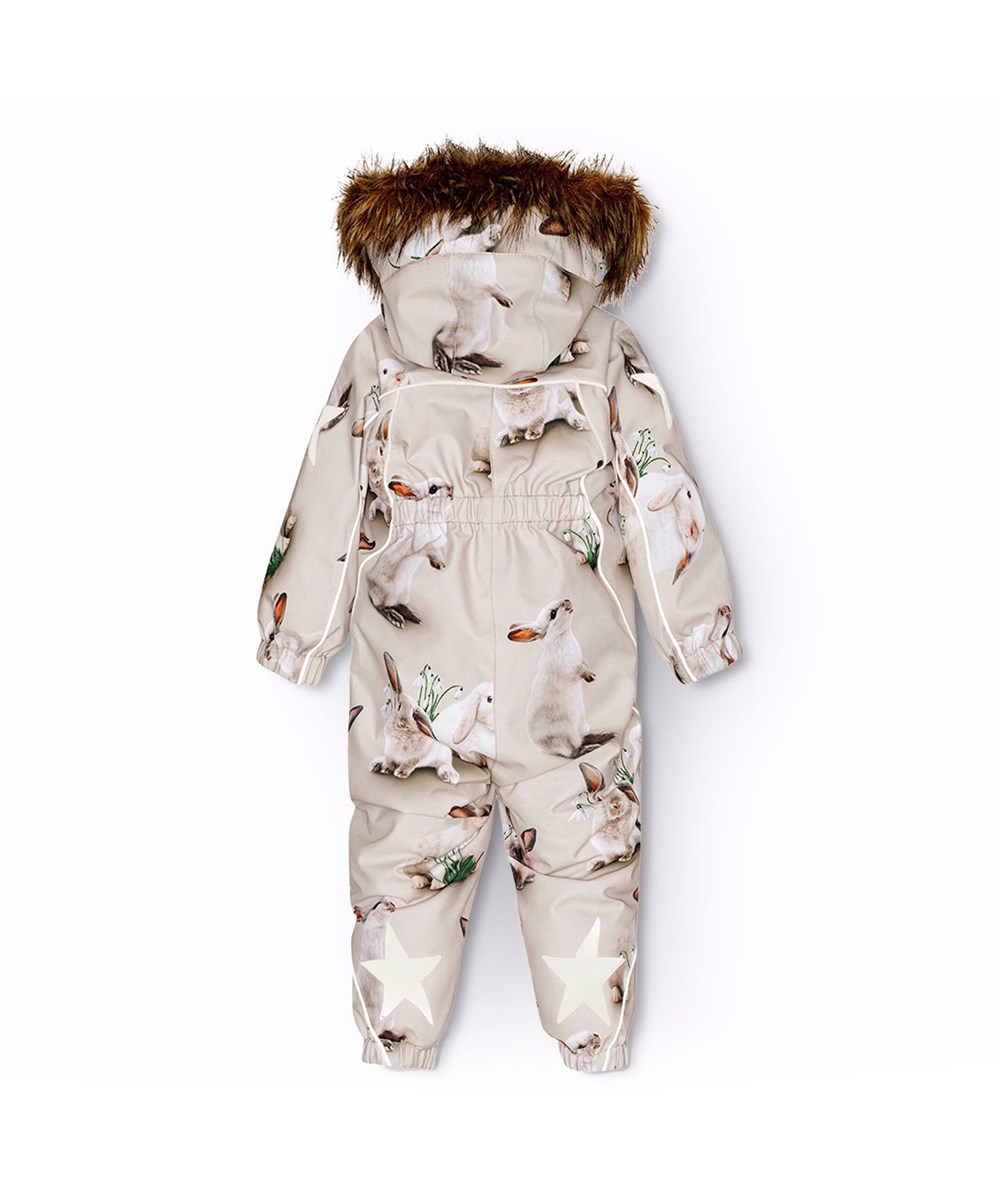 Pyxis Fur - Winter Rabbits - Children's snowsuit in recycled polyester with a print of cute rabbits among snowdrops on a grey background.
