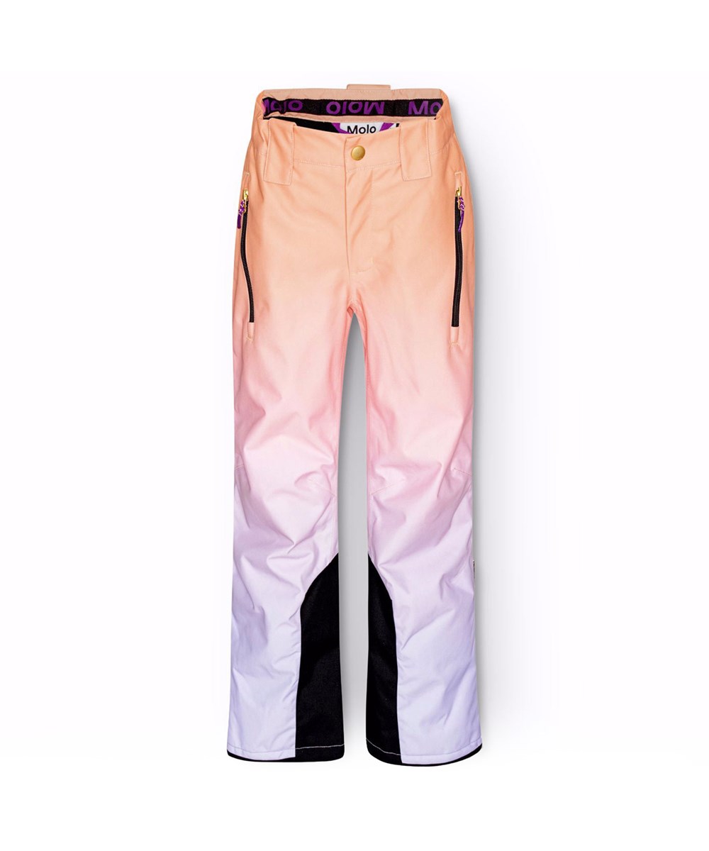 Jump Pro - Gradient Lilac - Vind- og vandtætte overtrækker til en kold vinter i genanvendt polyester, i orange, lyserød og pastellilla gradient farver. Bukserne er foret med 3M™ Thinsulate™