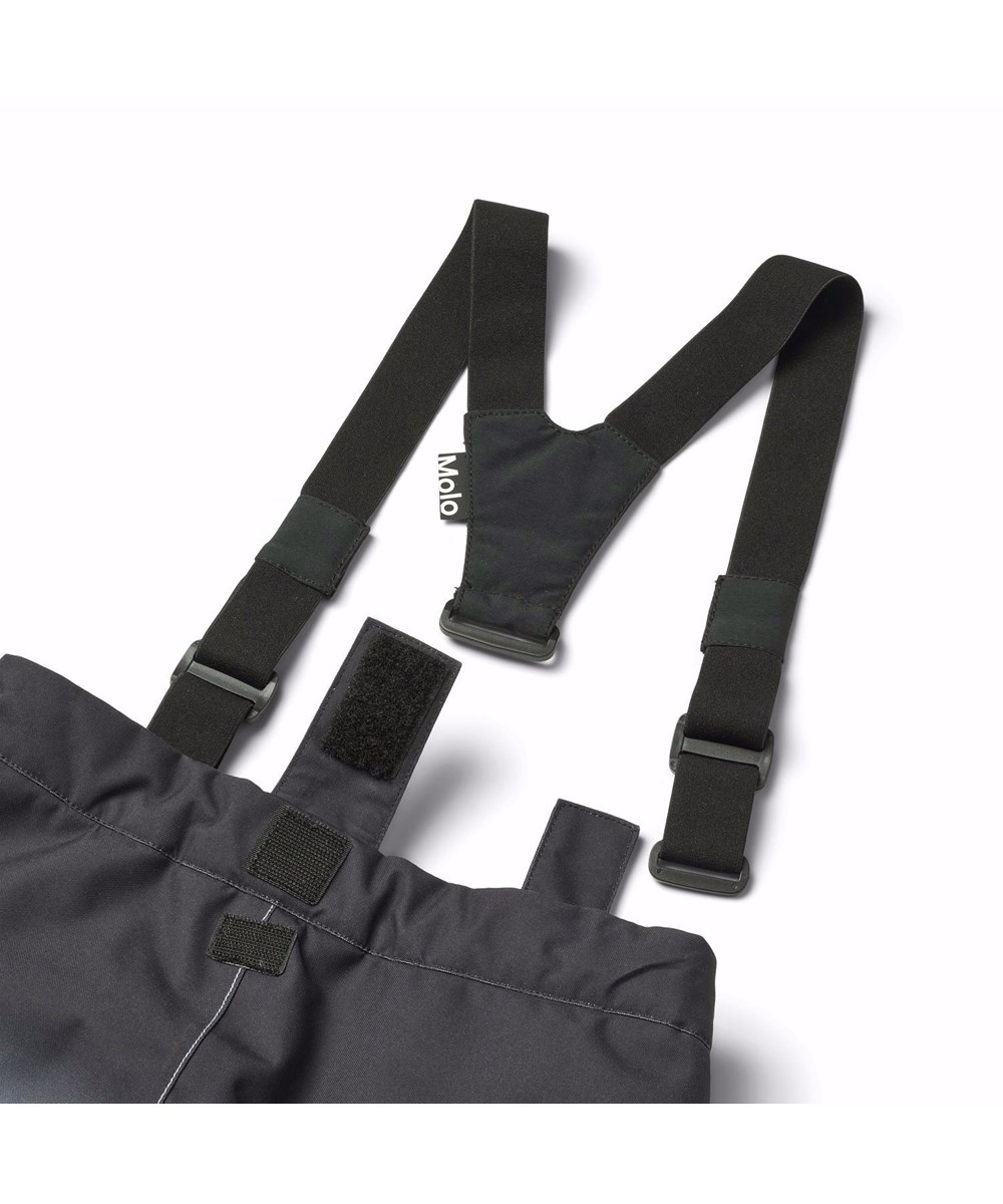 Jump Pro - High In Sky - Vind- og vandtætte overtrækker til en kold vinter i genanvendt polyester, med et print af snedækket alper, solens skær og en klar blå himmel. Bukserne er foret med 3M™ Thinsulate™