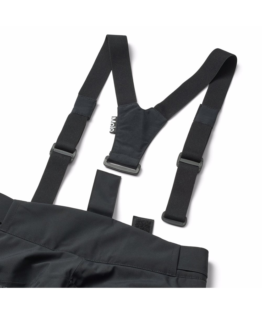 Jump Pro - Black - Sorte vind- og vandtætte overtræksbukser til børn i genanvendt polyester. Bukserne er vatteret med 3M™ Thinsulate™