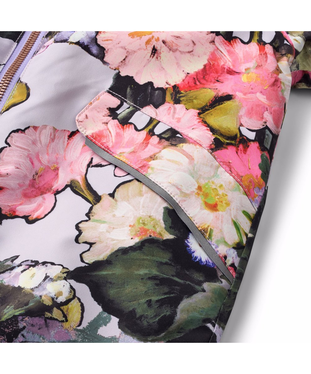 Hyde - Flower Art - Vandafvisende blomstret flyverdragt til de mindste, fremstillet i genanvendt polyester.