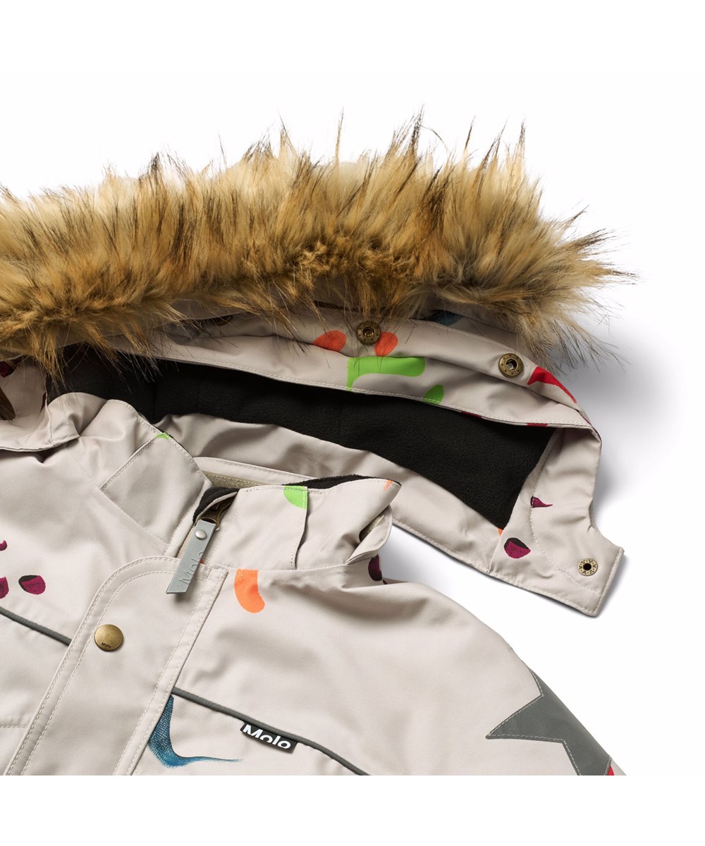 Polaris Fur - Arty Emotions - Vind- og vandtæt flyverdragt med et print af farverige smilende ansigter til en kold vinter eller skiferien til en kold vinter eller skiferien i genanvendt polyester og vatteret med 3M™ Thinsulate™.