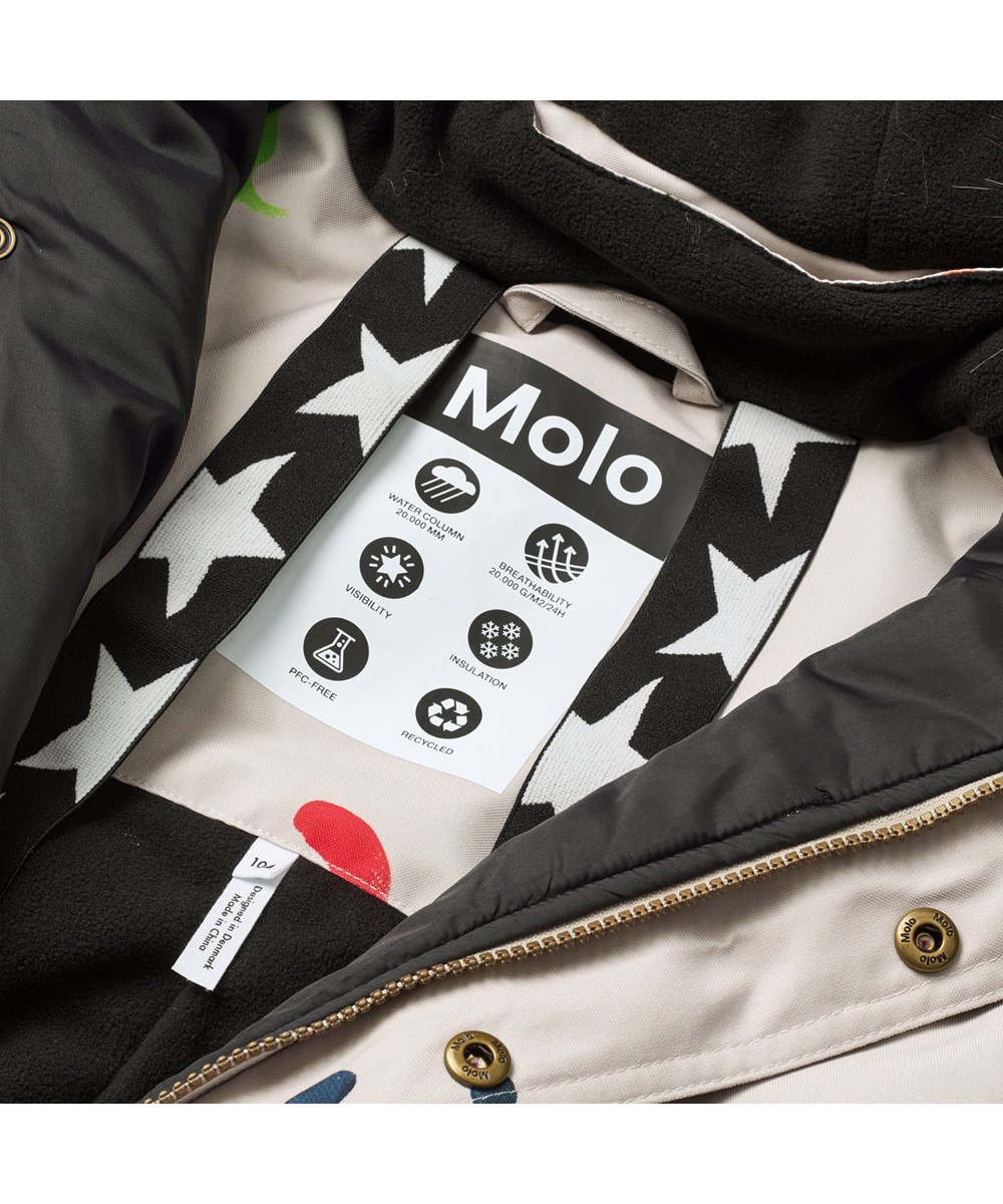 Polaris Fur - Arty Emotions - Vind- og vandtæt flyverdragt med et print af farverige smilende ansigter til en kold vinter eller skiferien til en kold vinter eller skiferien i genanvendt polyester og vatteret med 3M™ Thinsulate™.