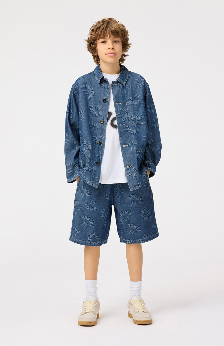 Halley - Word Smiles - Blå denimjakke til børn i blødt bomuld med et vævet flot jacquardmønster med smilende ansigter og positive ord som mund.