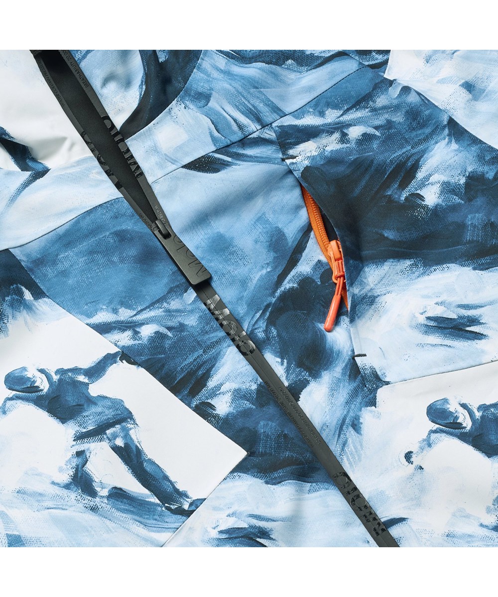 Alpine - Arty Mountains - Vind- og vandtæt blå og hvid vinterjakke til børn i genanvendt polyester samt vatteret med 3M™ Thinsulate™.