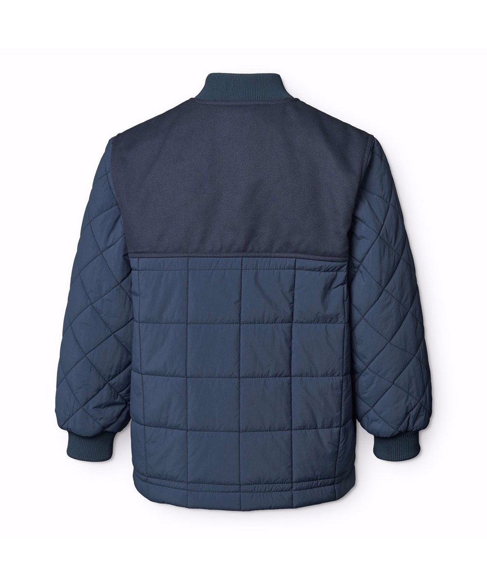 Harold - Mood Blue - Mørkeblå, quiltet, vandafvisende termojakke til børn i genanvendt nylon med canvas detaljer og en lynlås brystlomme.