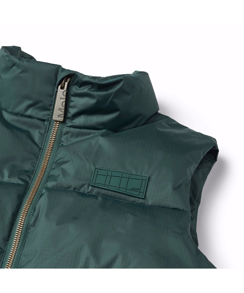 Heike - Ponderosa Pine - Vind - og vandafvisende petroliumsgrøn varm vest til de koldere dage i genanvendt polyester