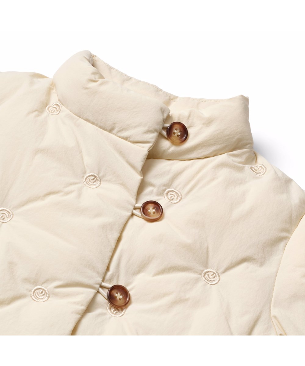 Hiroku - White Noise - Råhvid vandafvisende quiltet jakke i genanvendt nylon til de mindste, med broderet små smilende ansigter.