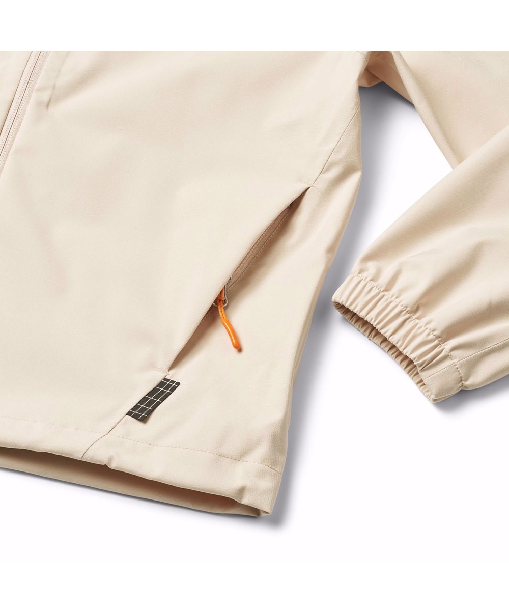 Horizon - Brazilian Sand - Beige vind- og vandafvisende jakke til børn i genanvendt polyester med hætte.
