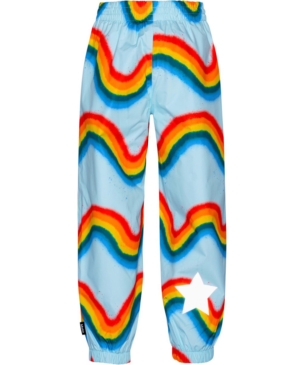 Waits - Rainbow Waves - Lyseblå regnbukser i åndbart materiale med print af regnbuer.