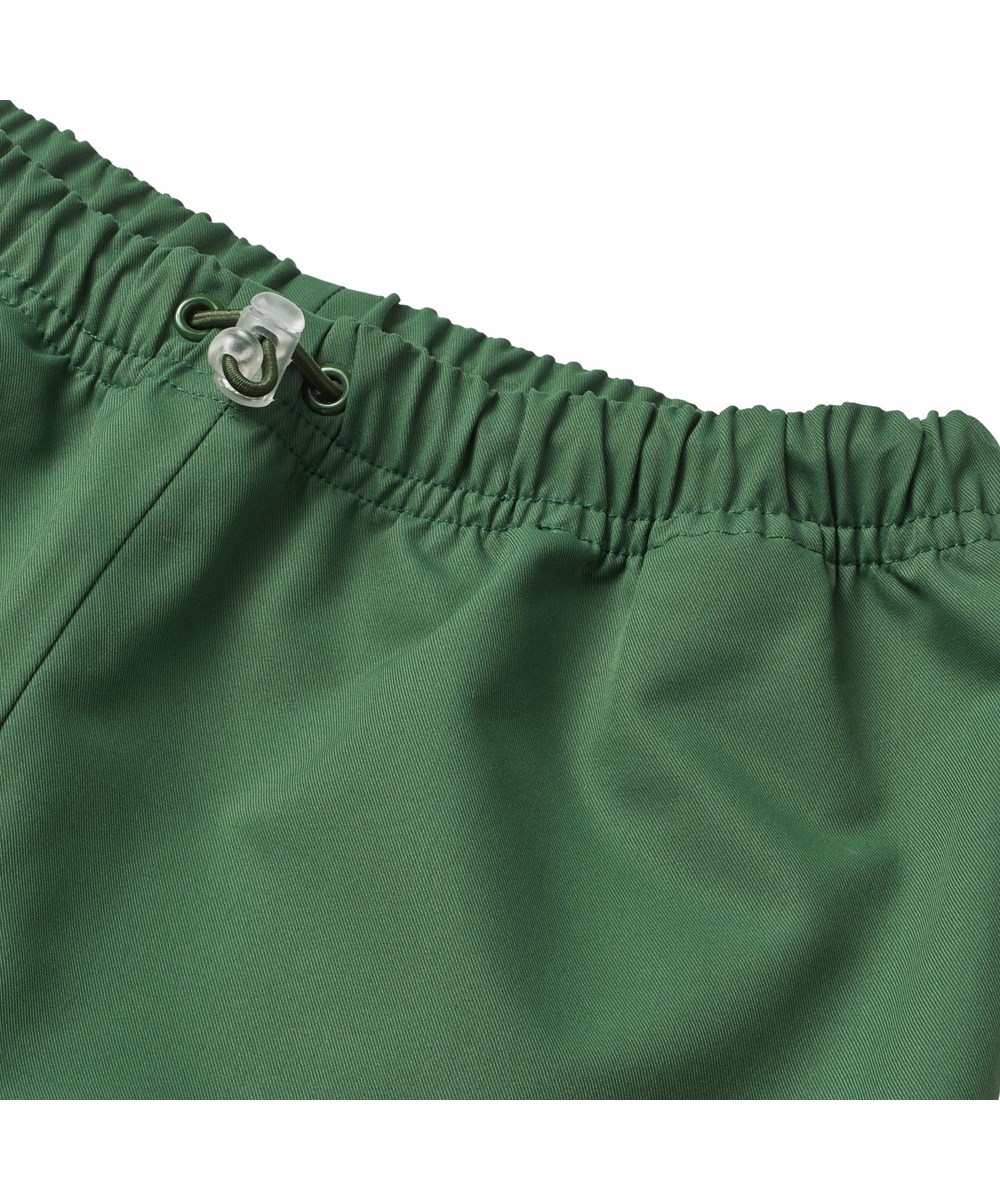 Waits - Rubber Tree - Grønne vind- og vandtætte regnbukser til børn i slidstærkt og genanvendt polyester.