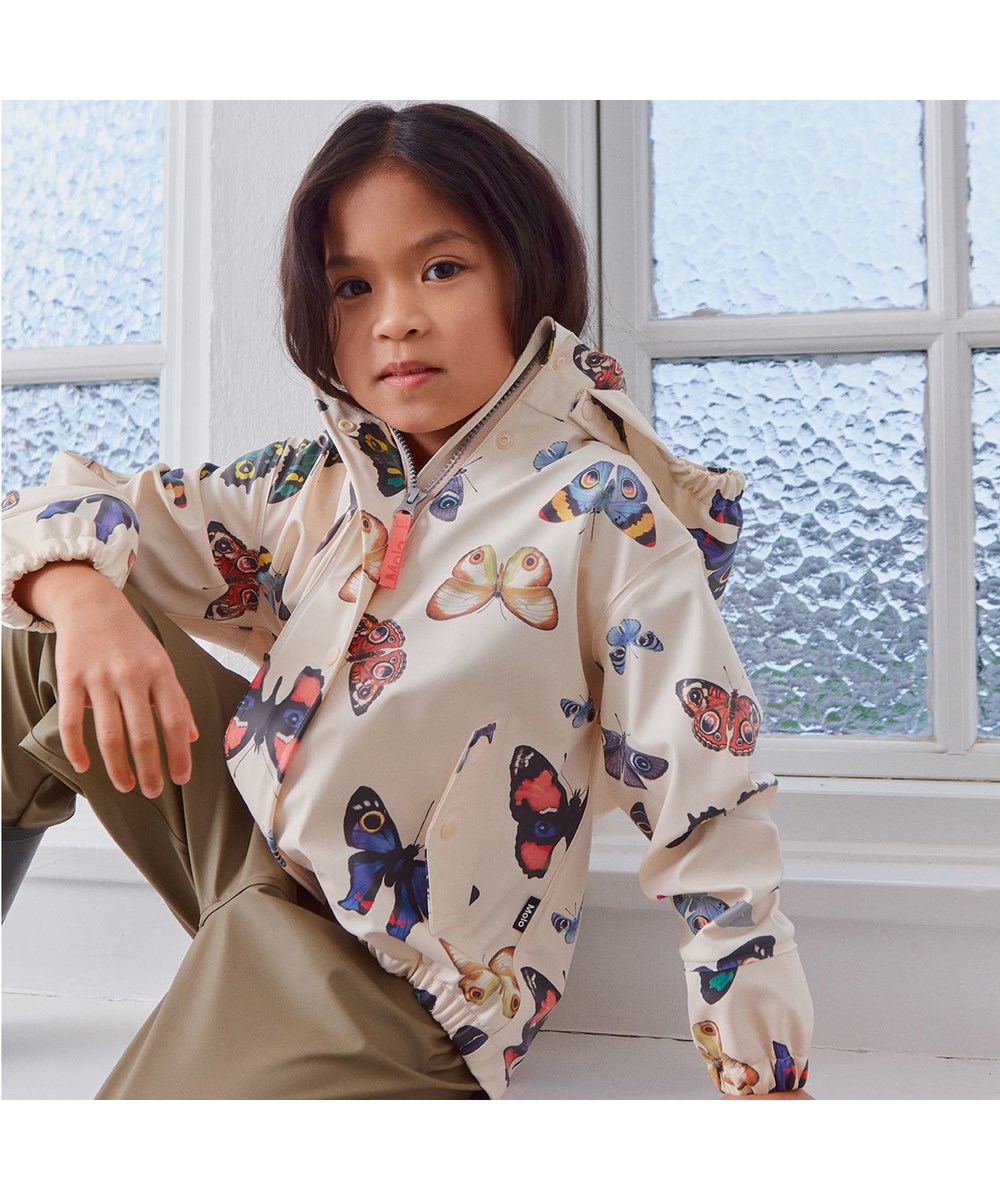 Zan - I See You Ivory - Recycled gummi regnjakke med sommerfugle print