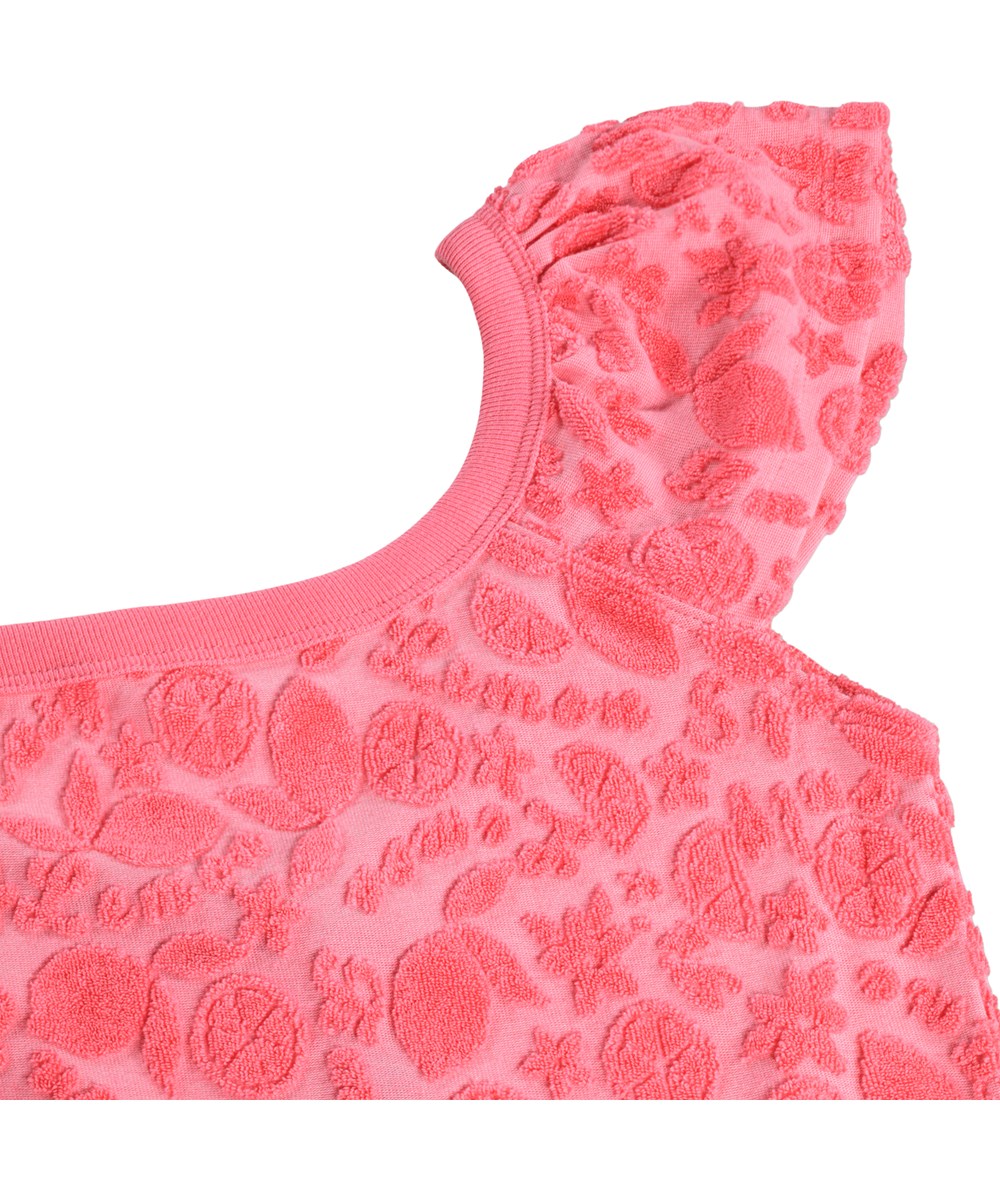 Avery - Lemon Quotes - Lyserød heldragt til børn med mønster af citrusfrugter i bomuldsfrotté.